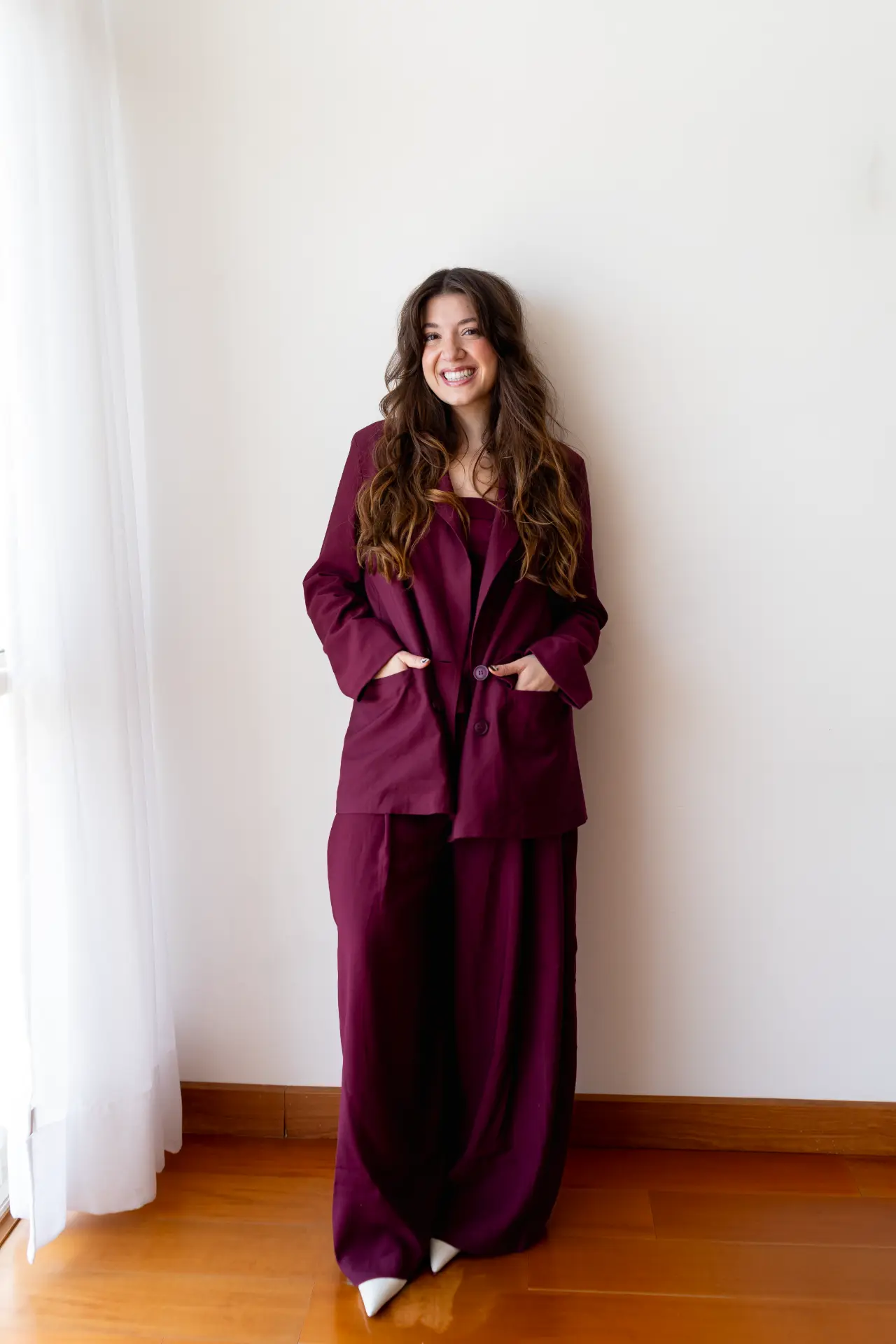 Catharina Doria in a burgundy suit