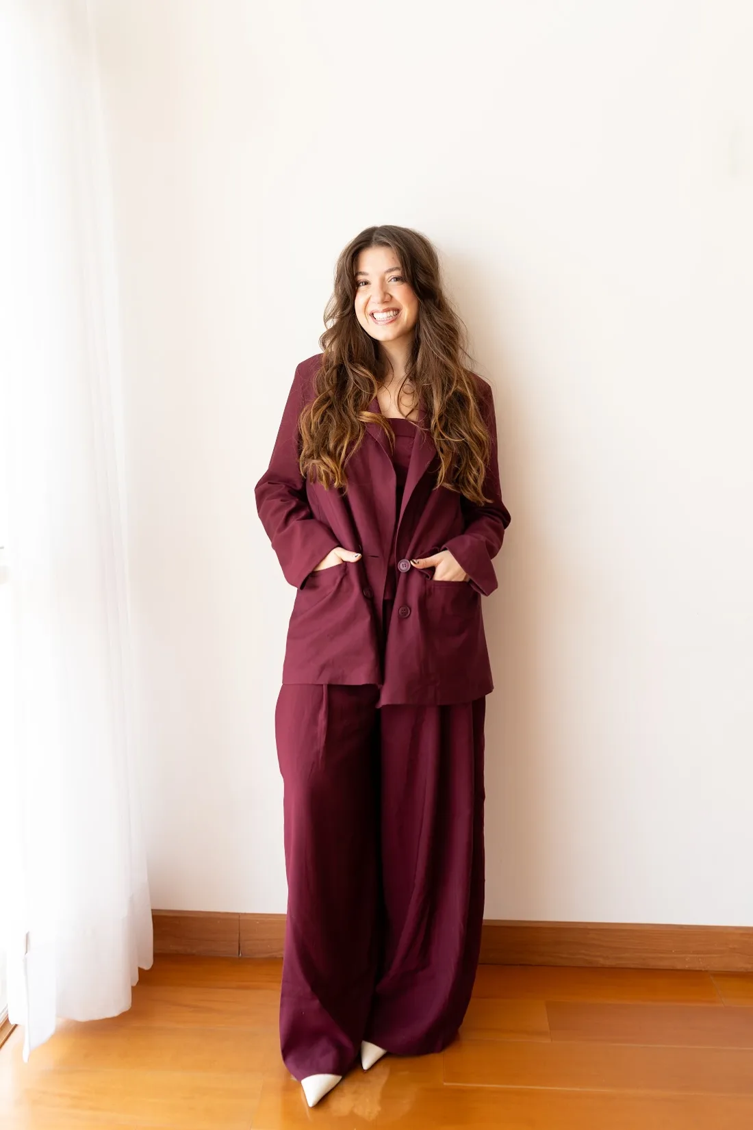Catharina Doria in a burgundy suit