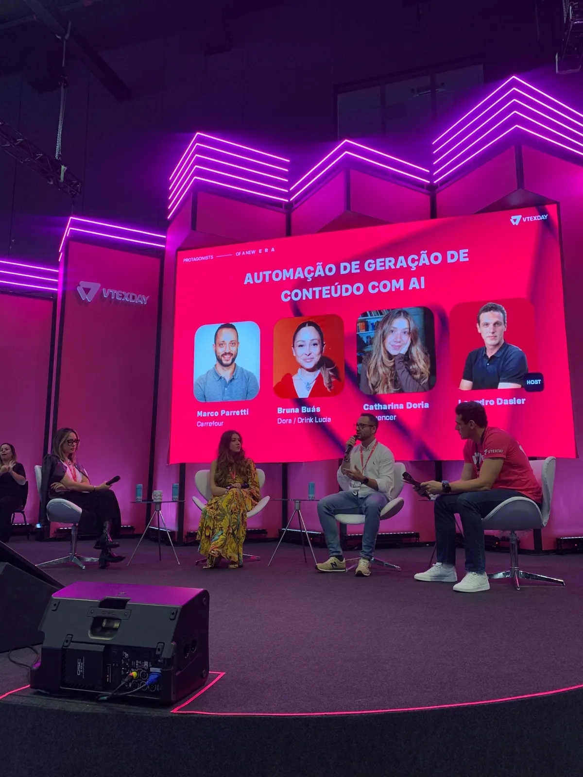 Catharina Doria on stage at VTEX Day on a panel about AI content automation
